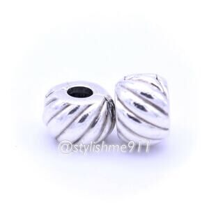 Two Authentic PANDORA Retired Feathered Clips - 791752